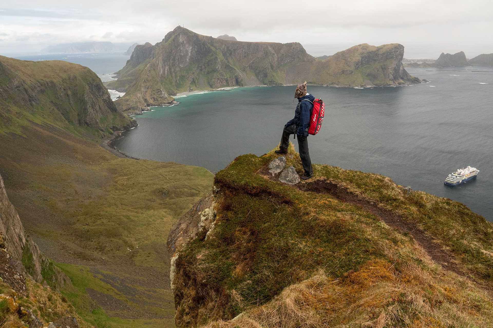 hiker on top of cliff