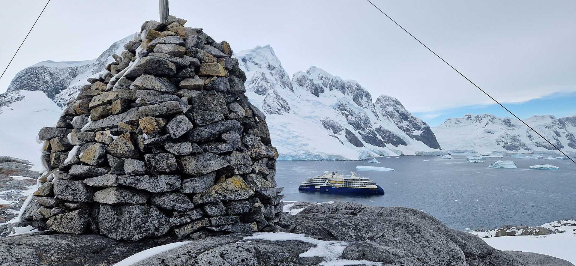 rock cairn with national geographic resolution visible in background