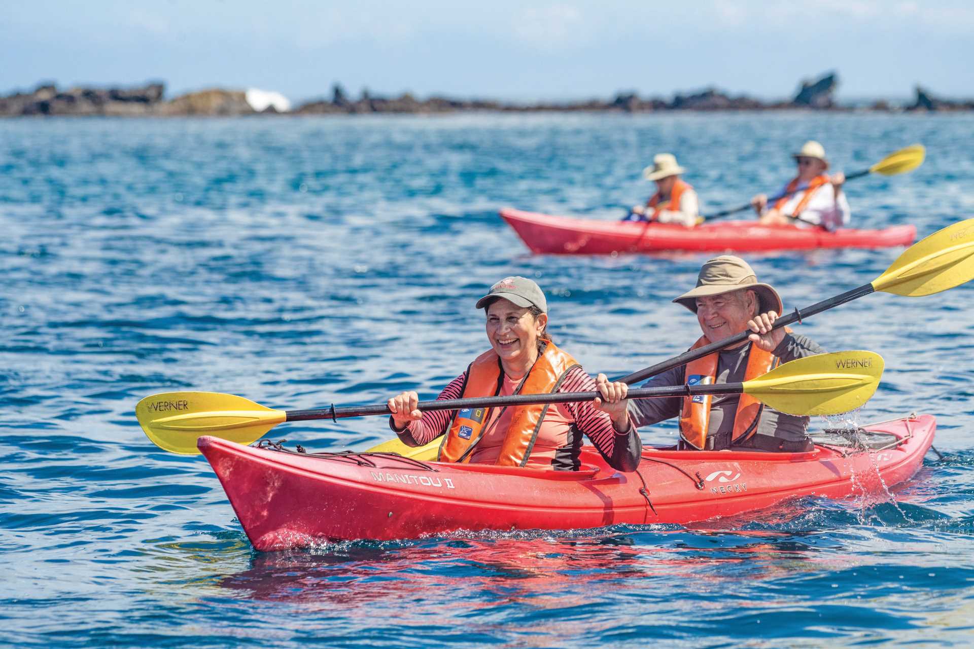 Kayakers explore Buccaneer Cove off Santiago Island, Galápagos.